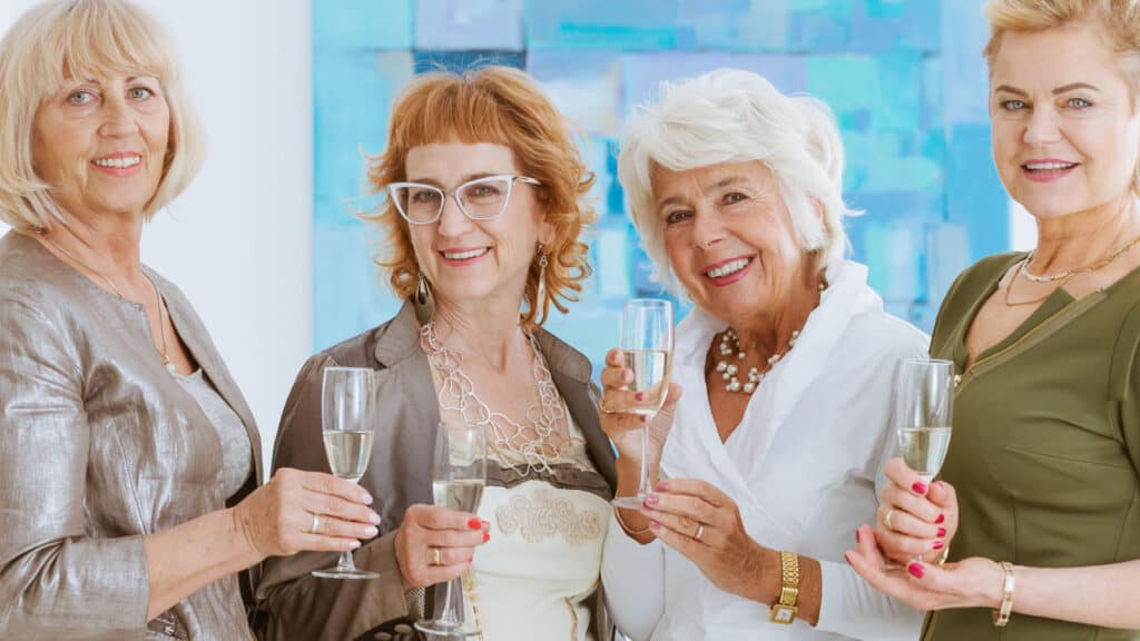Four women drinking champagne. 