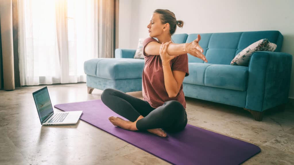 Woman doing yoga at home.