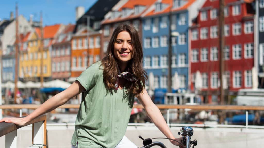Woman riding bike in Denmark. 