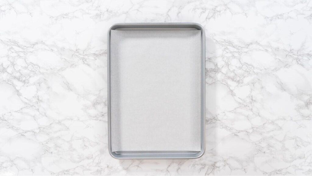 Half sheet pan with parchment paper.