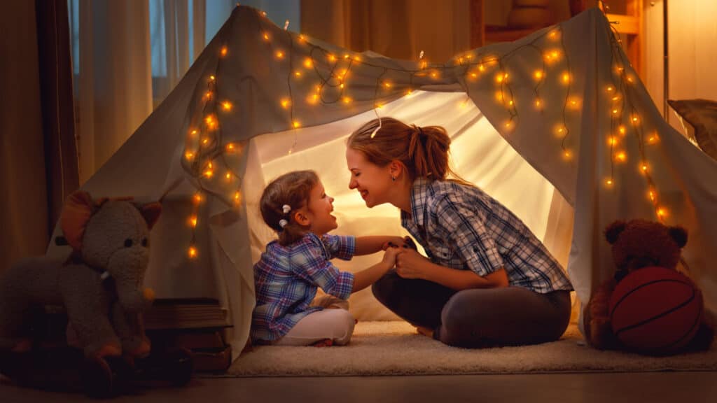 Woman and child in play tent.