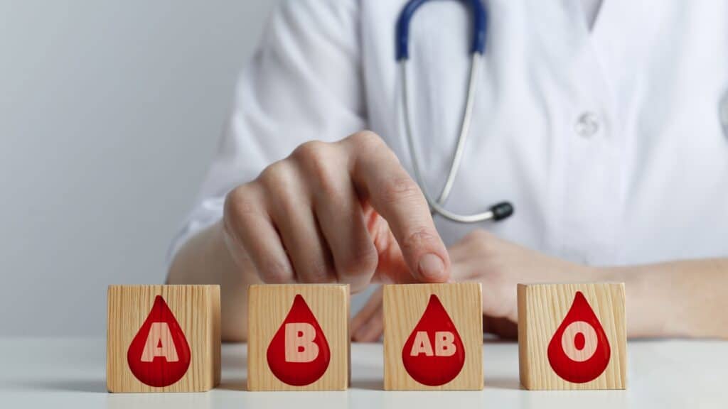 Doctor pointing to AB blood type block. 