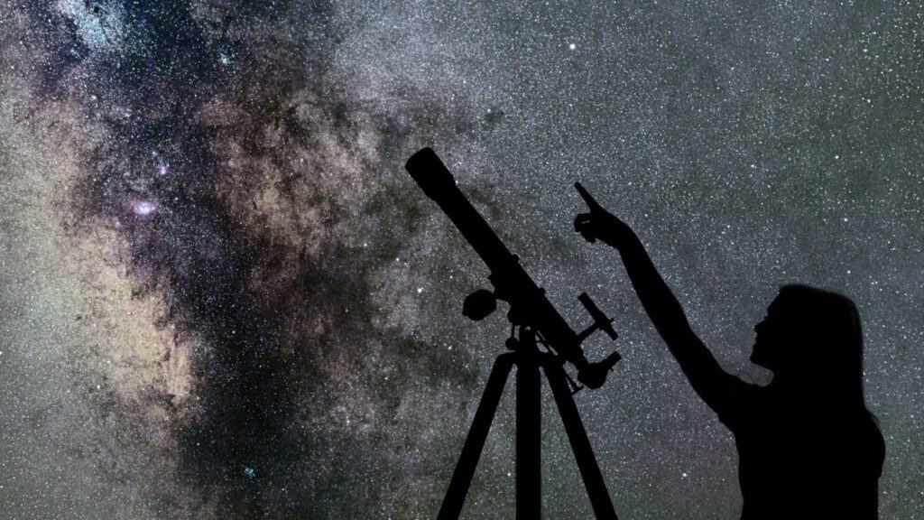 Girl looks at Milky Way. Telescope. 