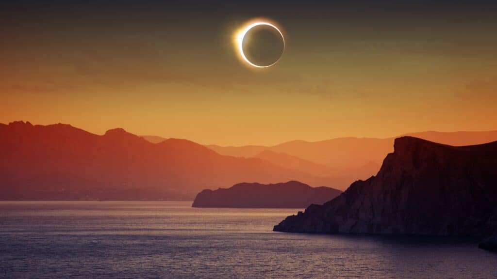 solar eclipse over water.