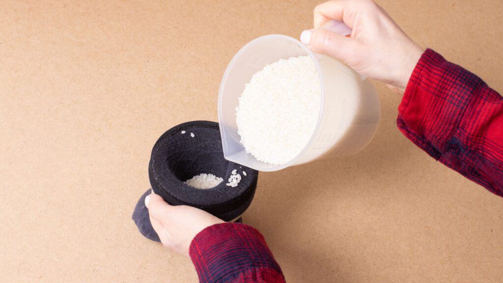 Filling sock with rice. 