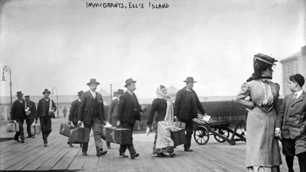 Immigrants at Ellis Island The Everett Collection via Canva Pro