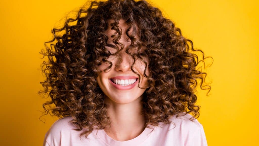 Woman with curly hair. 
