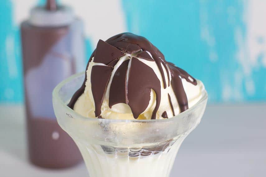 chocolate-shell-shattered-on-vanilla-ice-cream-in-glass-dish.