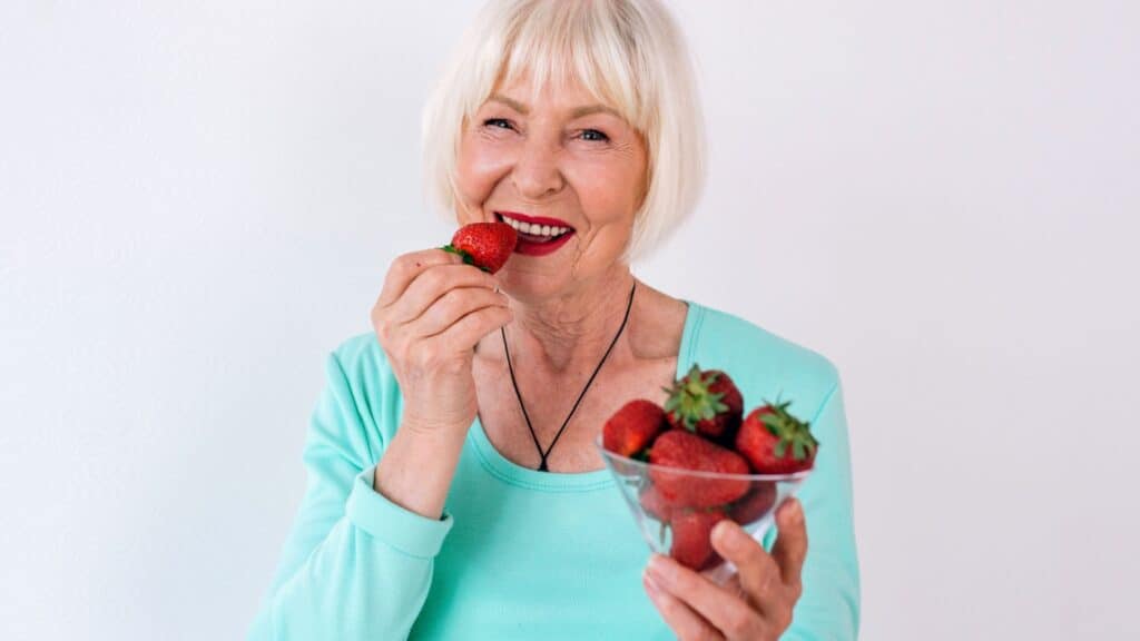 woman eating berries.