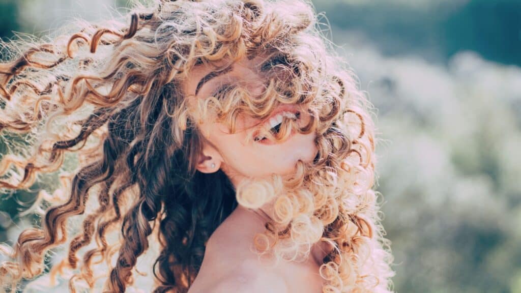 woman with curly hair.