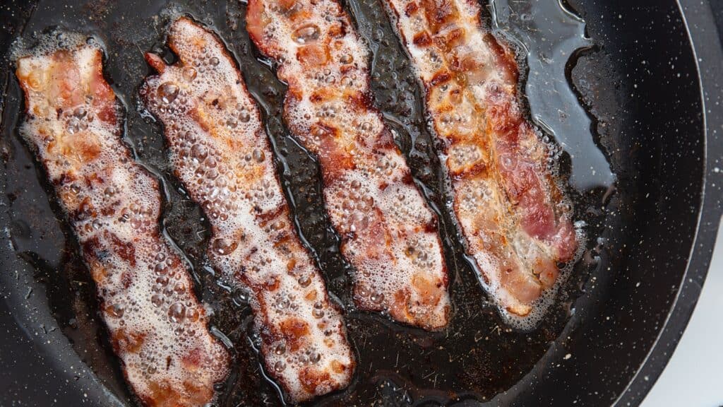 Bacon cooking. Bacon fat.