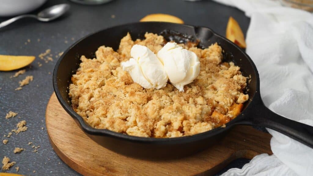 Smoked-Peach-Cobbler-in-skillet.