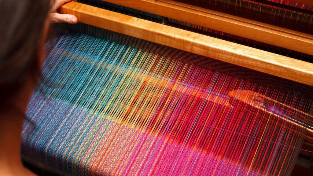 Weaving on loom. 