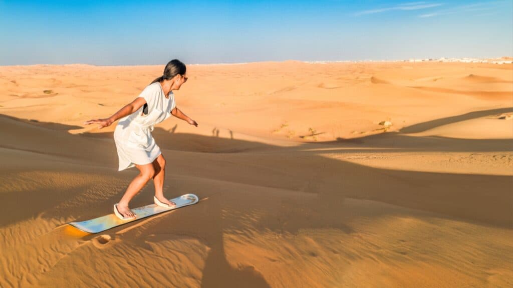 Woman sand boarding.