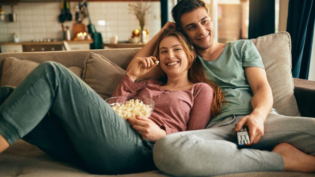 couple on couch. popcorn.