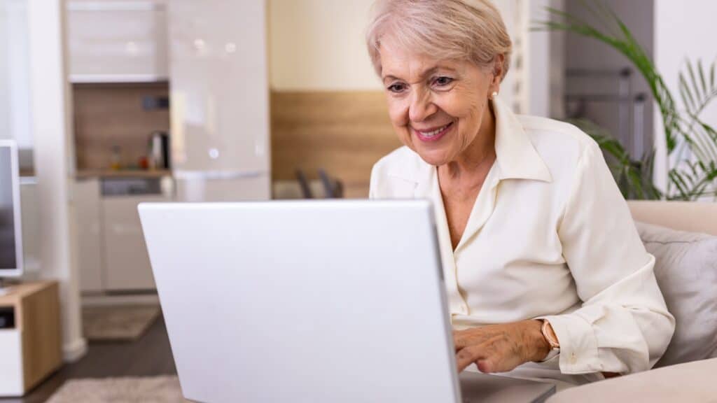 senior woman online laptop. 