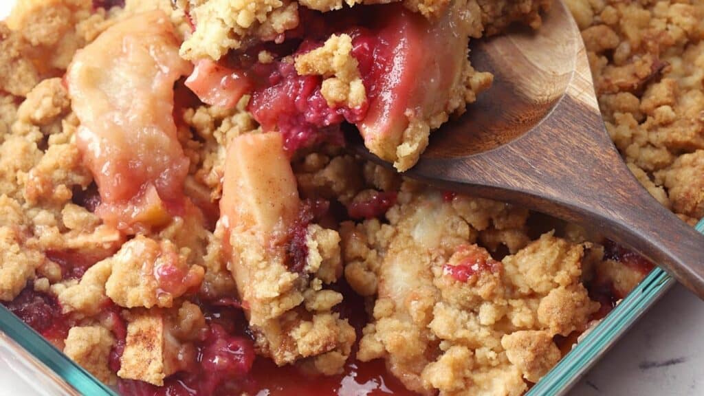 spoon-scooping-apple-raspberry-crumble.