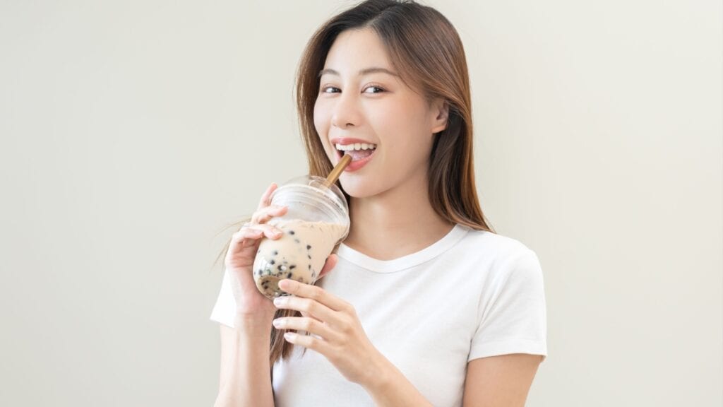 woman drinking boba tea. 