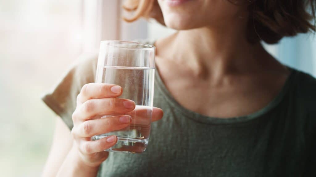 Woman drinking water.