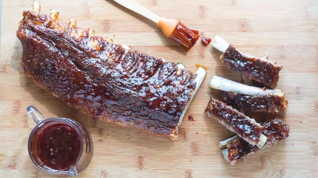 overhead-view-of-Low-FODMAP-Pineapple-Whiskey-BBQ-Ribs-on-wooden-board-1.