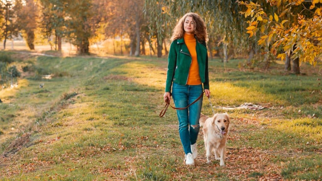 woman and dog walking. 