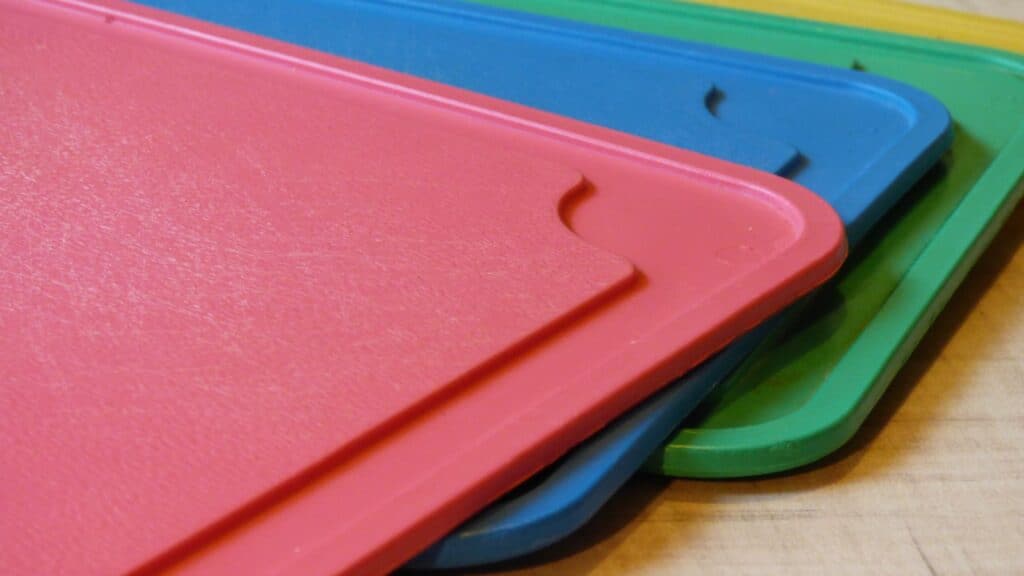 Colored plastic cutting boards. 