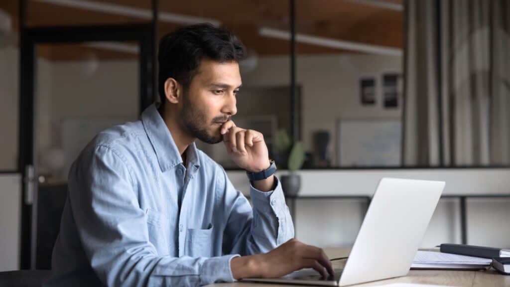 Critical listening. Computer. Online. Pensive. Thinking.