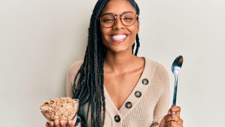 Woman with whole grain cereal.