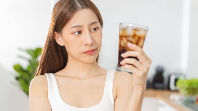 Woman wondering about soda.