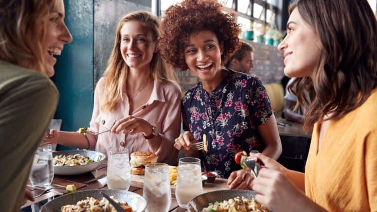 Women eating in restaurant.