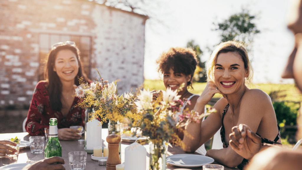 women wearing makeup at outdoor party. 