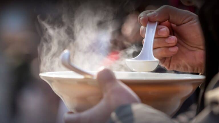 side shot of steaming bowl of soup