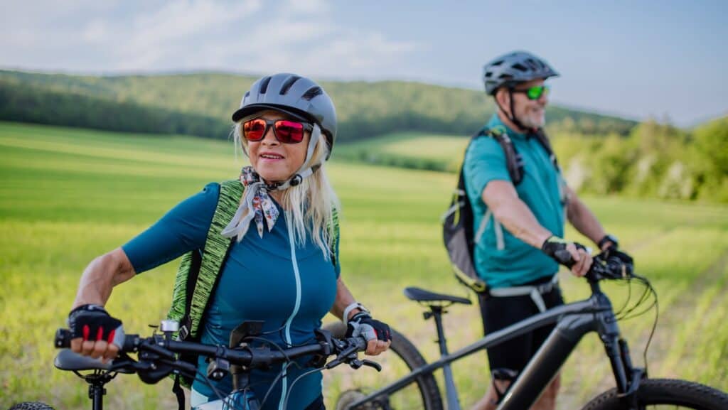 couple in bike helmets. 