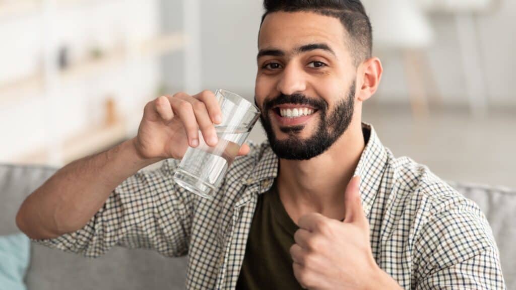 man drinking water.