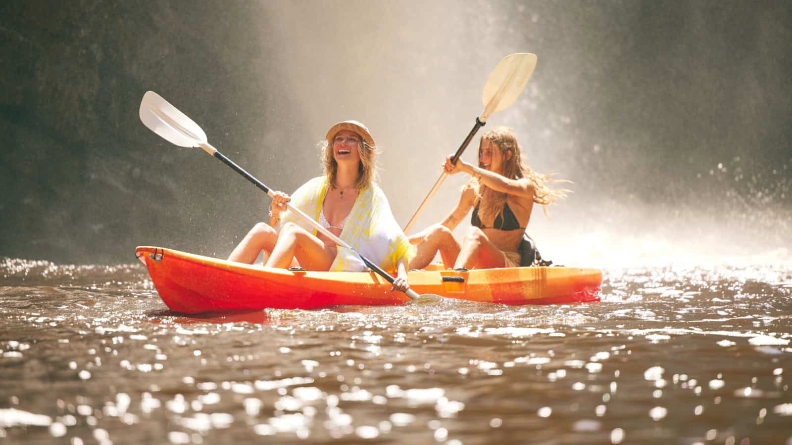 women friends paddling.