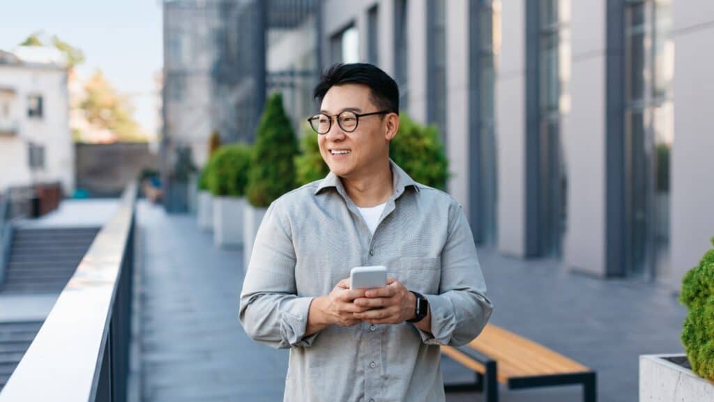 asian man with phone.