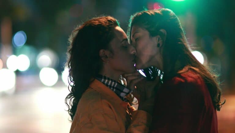 gay women kissing.