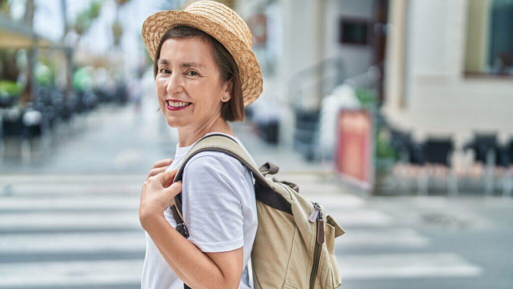 woman in hat with backpack. 